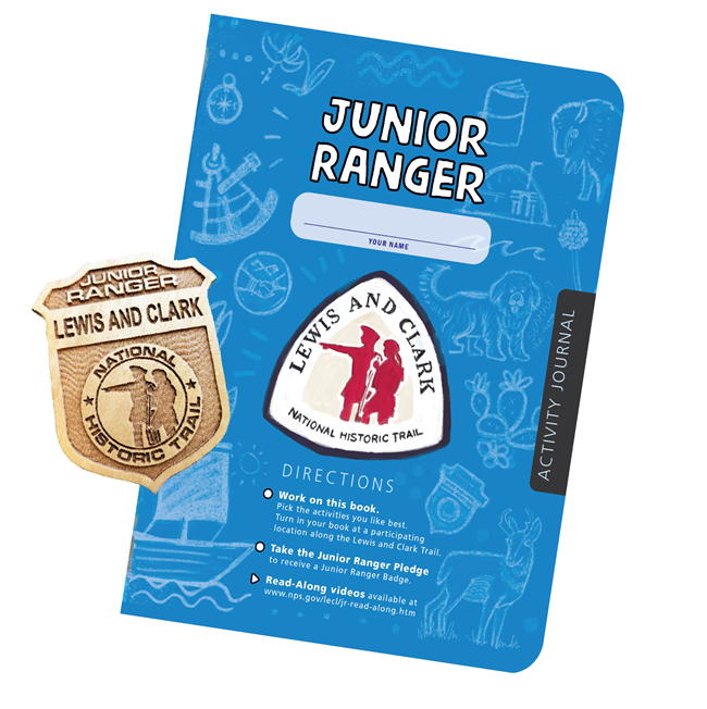 a blue workbook and wooden badge
