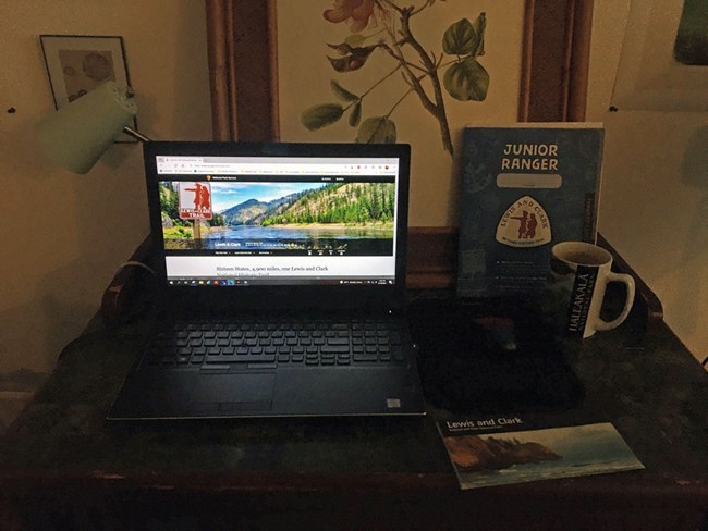 Lewis and Clark Trail website on laptop. Laptop sits on desk.