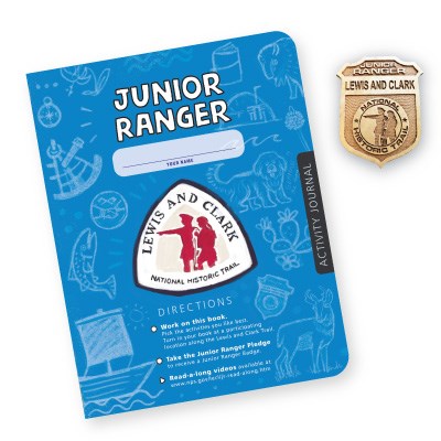 Booklet and Badge. Booklet is blue features Lewis and Clark Trail logo. Booklet reads Junior Ranger. Badge reader Junior Ranger
