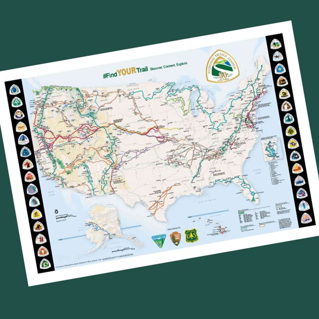 Map of National Trails System in U.S. shows vast complicated network of routes across the country. National Trails logos.