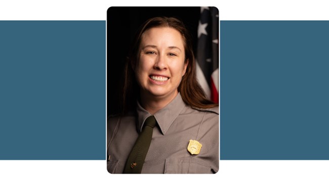 Portrait of woman in Park Service Uniform, dark brown hair. American flag background.