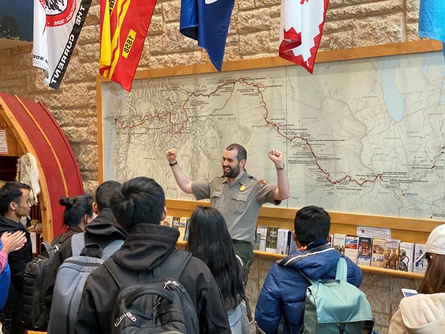 Ranger addresses group inside visitor center