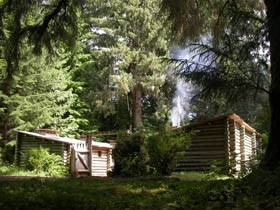 Fort Clatsop, a log fort, surrounded by forest. Fort Clatsop, a log fort, surrounded by forest.