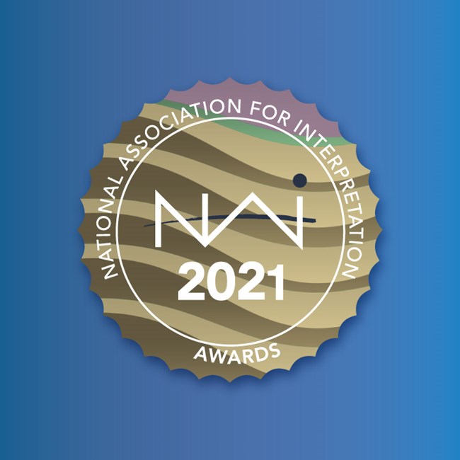 Gold award seal logo. NAI Media Award 2021. National Association for Interpretation.