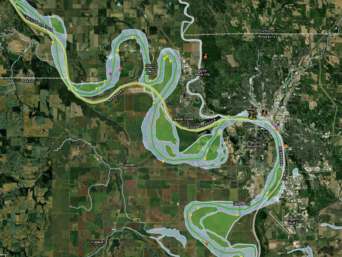Park Atlas with Satellite view. Missouri River winds around NE, SD, and IA. Mosaic of development, farms, prairie.