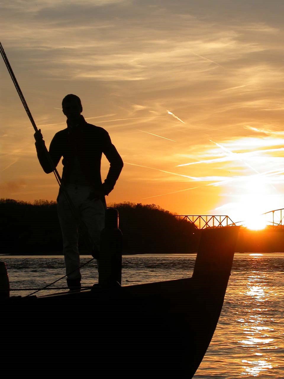 Josh in keelboat.2001for web2 man on boat on Ohio River