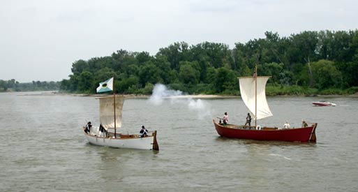 Replicas of red pirogue and white pirogue on the Missouri River in Omaha, NE. Replicas of red pirogue and white pirogue on the Missouri River in Omaha, NE.