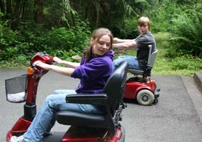 YCC students practicing with scooters for physically impaired visitors