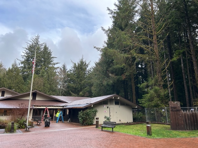 Front of the visitor center surrounded by a chain link fence.