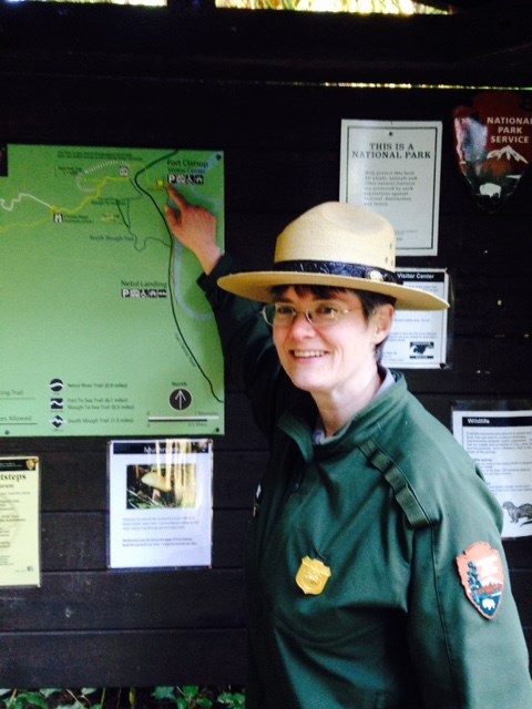 Park Ranger Sally pointing to trail map.