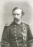 Black and white portrait of George Custer in a military uniform