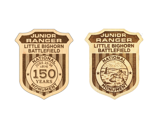 Two wooden Junior Ranger Badges