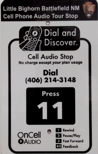 cell phone audio tour road sign: dial (406)214-3148