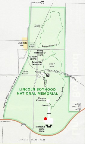 Map of park with red dot near visitor center parking lot indicating location of designated first amendment location.