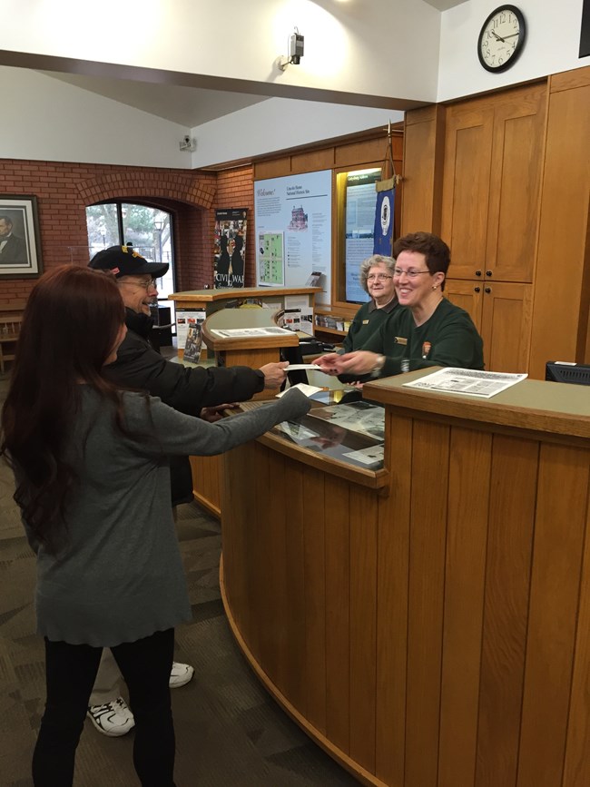 Volunteers assist visitors