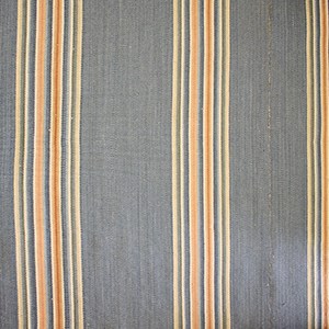 Striped carpet of thick blue stripes and groups of thin yellow-white, red-orange, and blue stripe.
