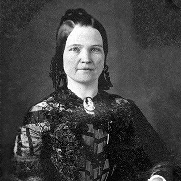 Young Mary Lincoln in dark dress, hair tied back with ringlets