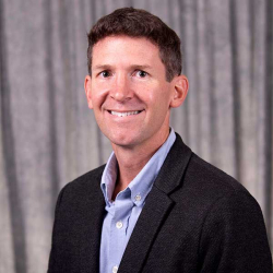 Dr. David Bertaina A photo of a man smiling, wearing a suit