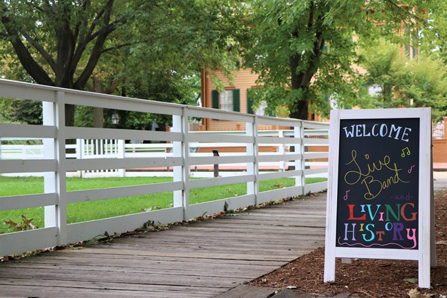 Sign advertising Living History and live music