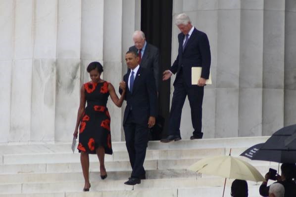 Four people on the steps of the Lincoln Memorial