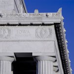 corner of lincoln memorial with blue sky behind