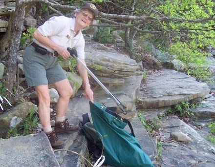 Shirley removing trash from the canyon.