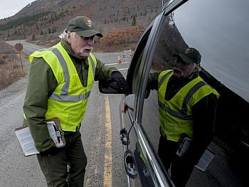 a Denali ranger gives instructions to a driver on the Denali Park road