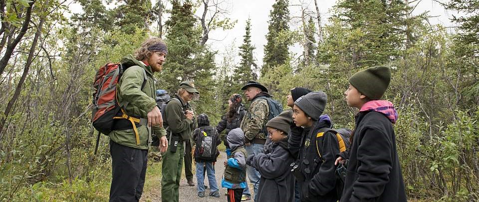 a ranger speaks to families on a trail at denali family camp