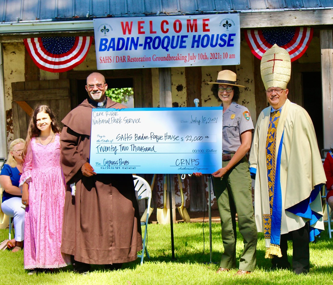 lt= Superintendent Carrie Murdorf, CRCNPS presents check for 22K - the value of cypress timber’s for restoration.