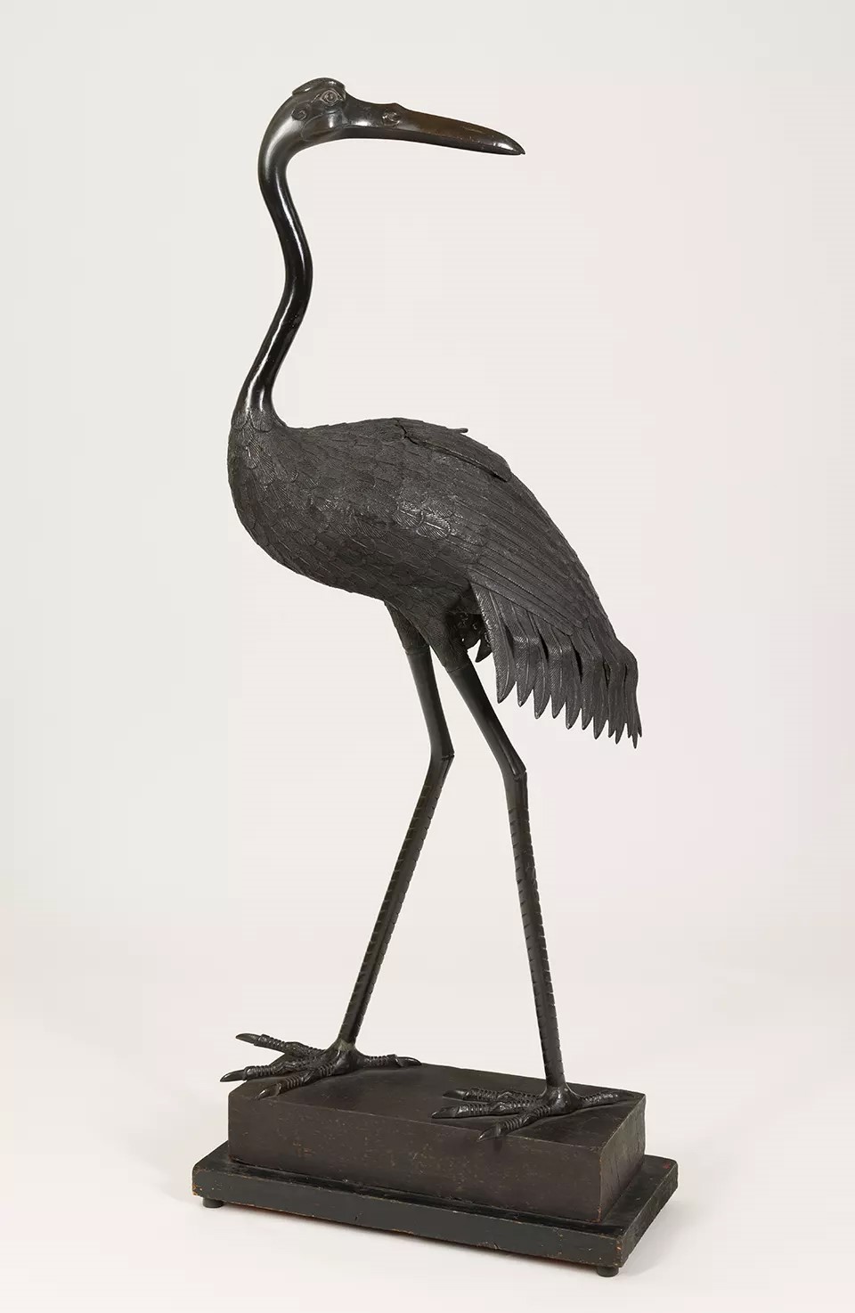 A Japanese bronze incense burner in the form of a crane.