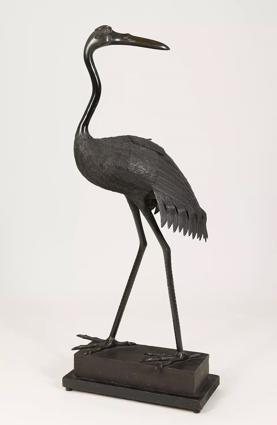 A Japanese bronze incense burner in the form of a crane. A Japanese bronze incense burner in the form of a crane.