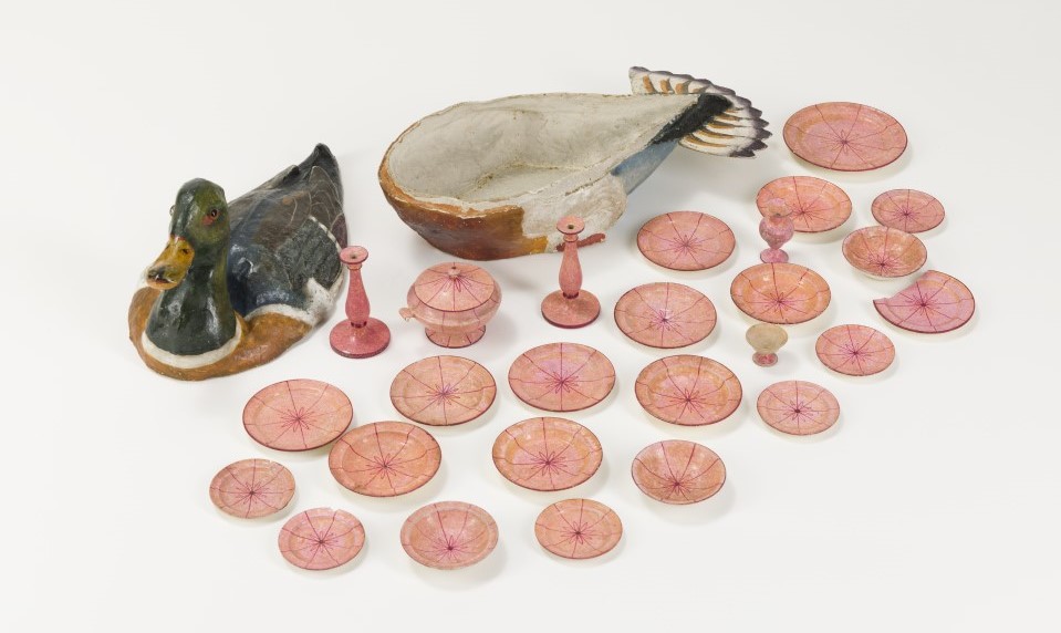 A doll's dining set and papier-mache box shaped like a duck. A doll's dining set and papier-mache box shaped like a duck.
