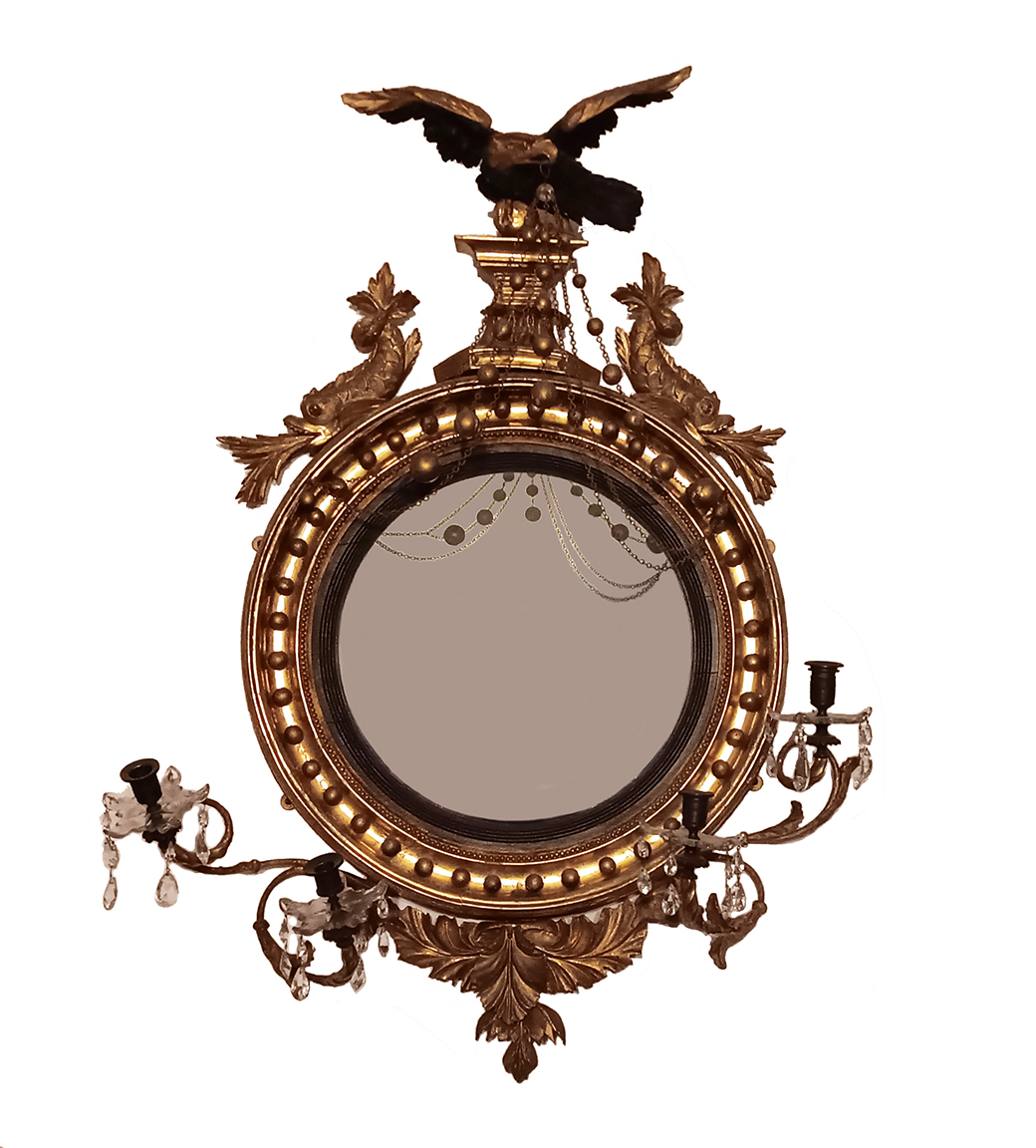 A Federal period girandole mirror with a carved eagle on top.