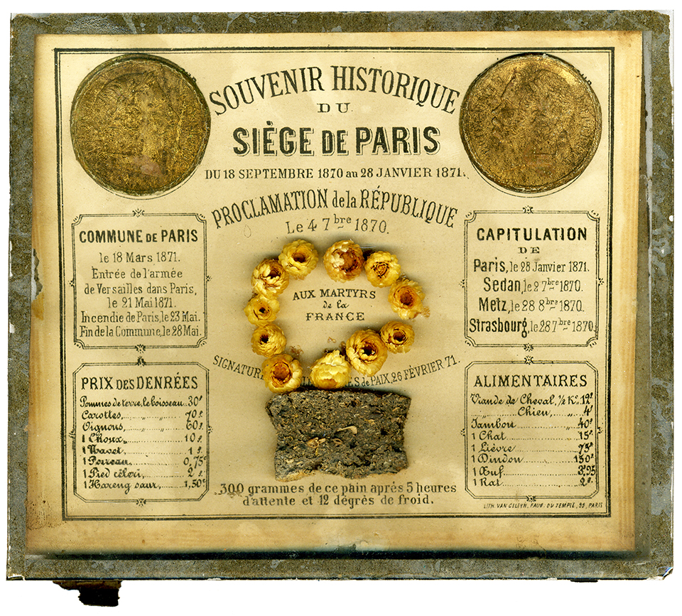 A card with a piece of bread and printed information from the 1870-1871 Siege of Paris. A card with a piece of bread and printed information from the 1870-1871 Siege of Paris.