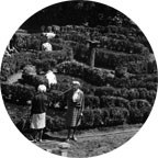 historic black and white photo of people in a garden