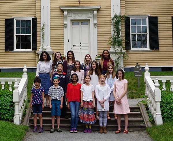 Group of smiling youth stand on the steps of the Longfellow House Group of smiling youth stand on the steps of the Longfellow House