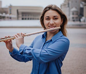Anabel Gil holding a flute