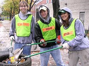 The University of Massachusetts - Lowell Ski Team illustrate the hands free way of picking up and dispensing of litter.
