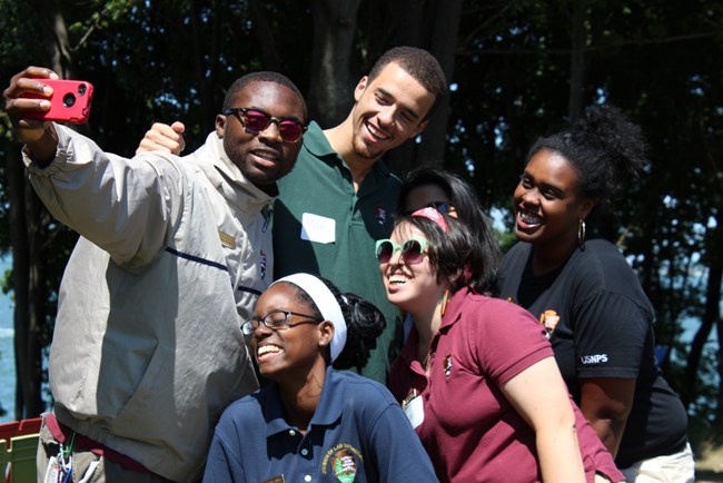 Diverse youths posing for a selfie.