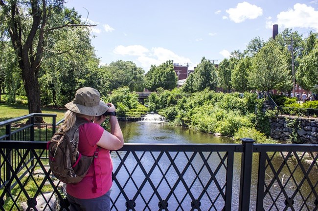 Woman taking a picture along the Western Canal