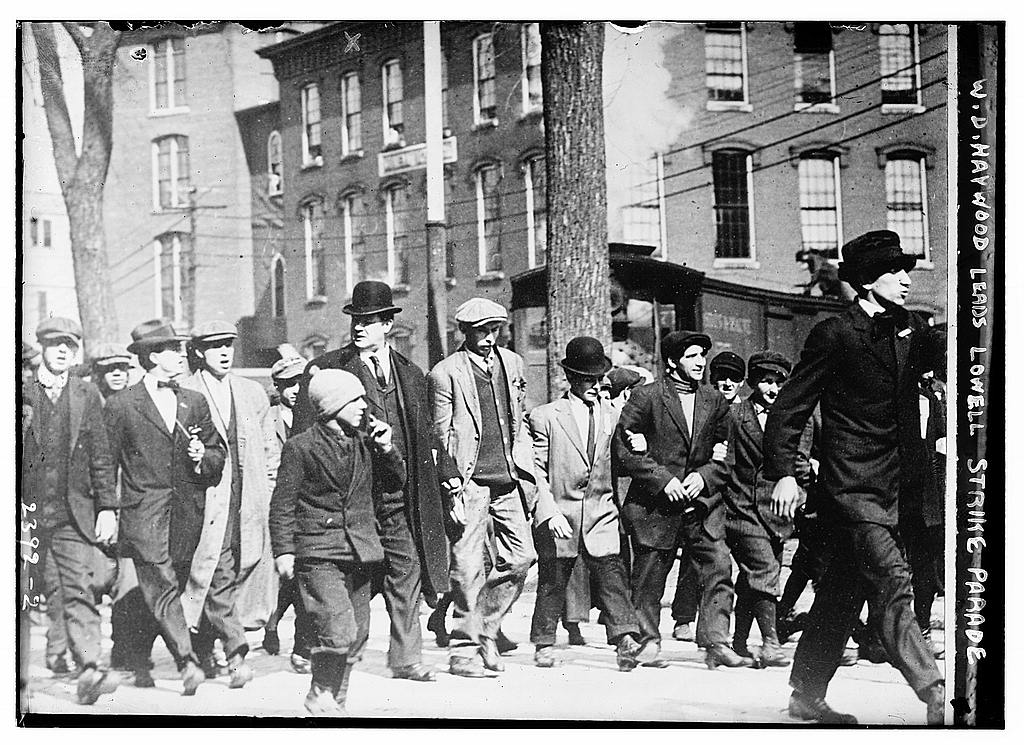 Mill workers march down the street during a 1912 strike Mill workers march down the street during a 1912 strike