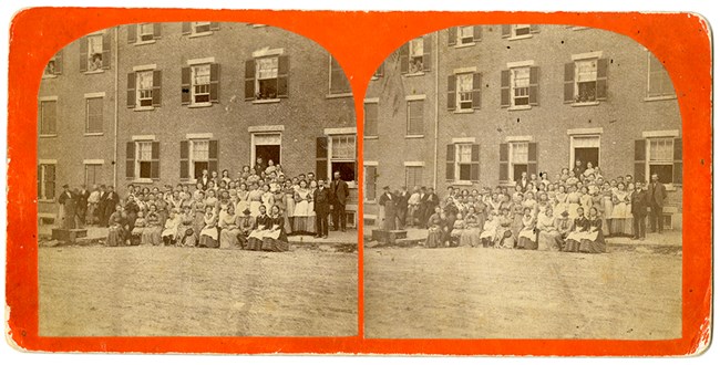A postcard of a boarding house and workers.