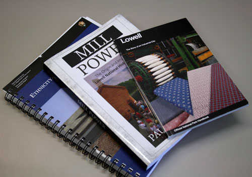 Three books stacked on top of each other.