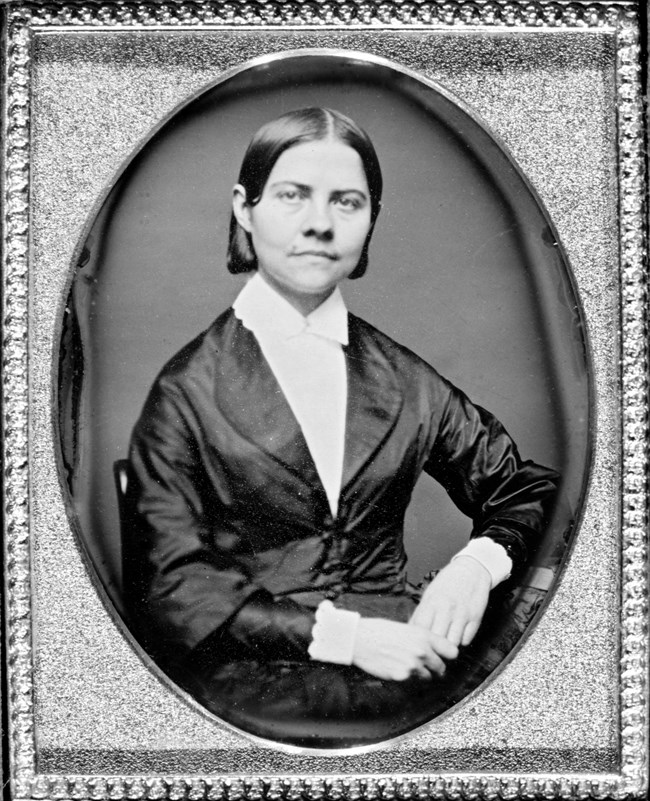 Lucy Stone, the Boston suffragist at odds with Harriet Robinson, sits posing for a picture.