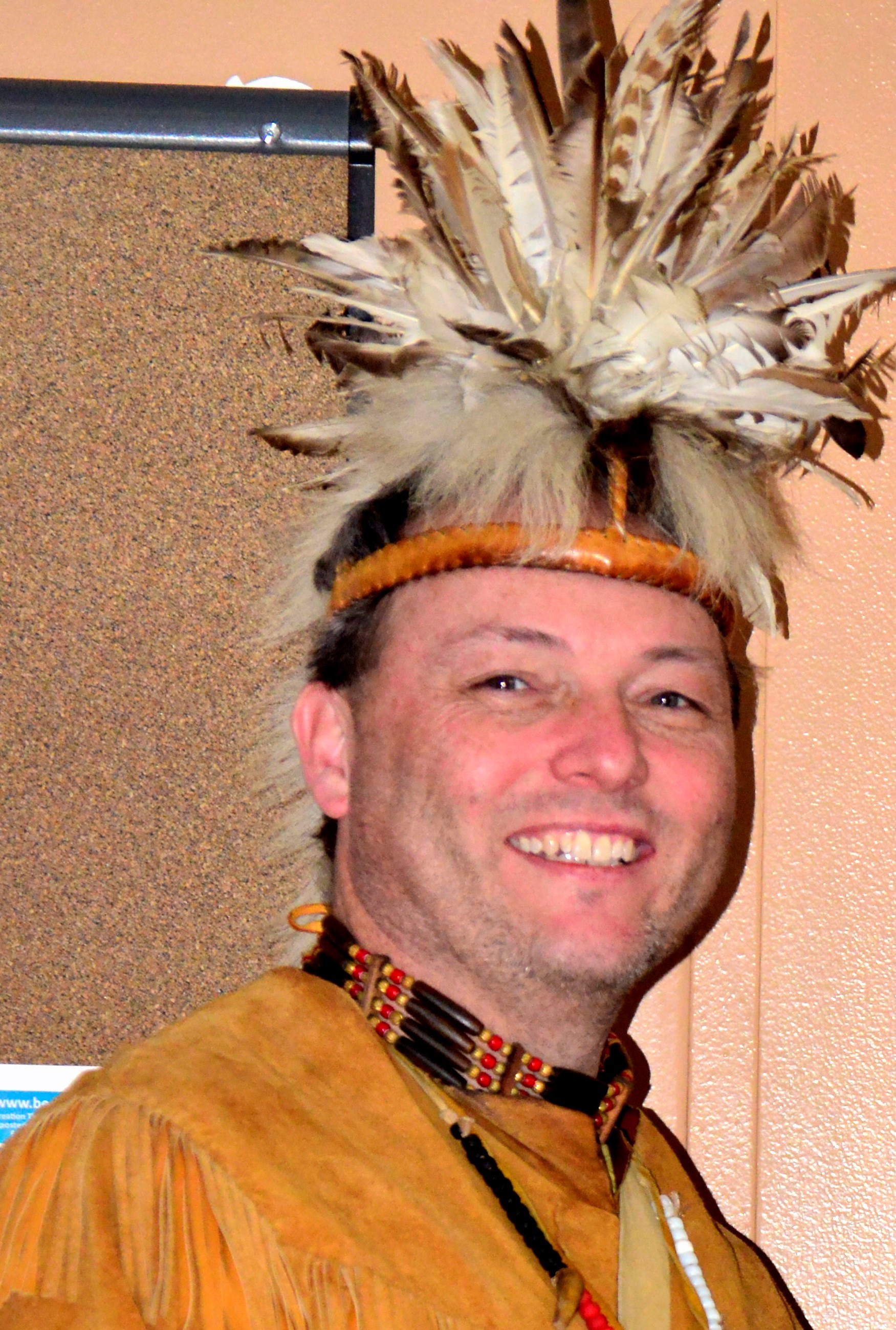 A man in traditional Native American clothing