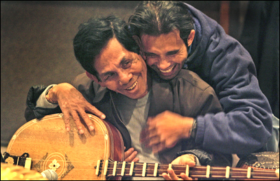 Arn Chorn-Pond (right), founder of Cambodian Living Arts, with Sarim Him at a rehearsal of