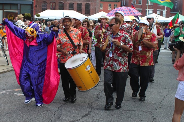 Jorge Arce and Comparsa Boricua leading the parade for the 26th Lowell Folk Festival, Friday, July 27, 2012.
