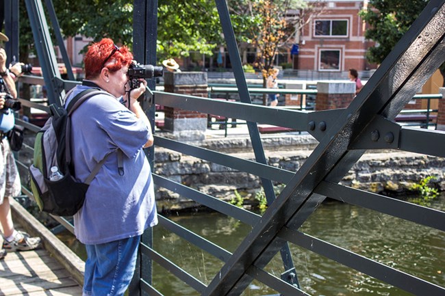 A visitor taking a photograph.