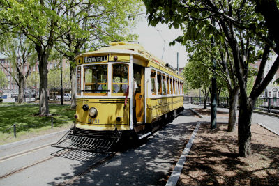 White over yellow closed car trolley # 4131 on a sunny day in Lowell, MA