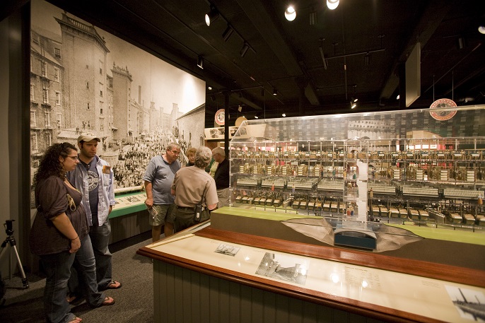 Visitors talk to a park ranger at the Boott Cotton Mills Museum